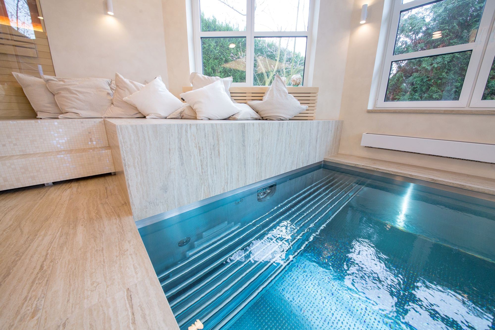 Atypically Shaped Indoor Pool with Massage Bench