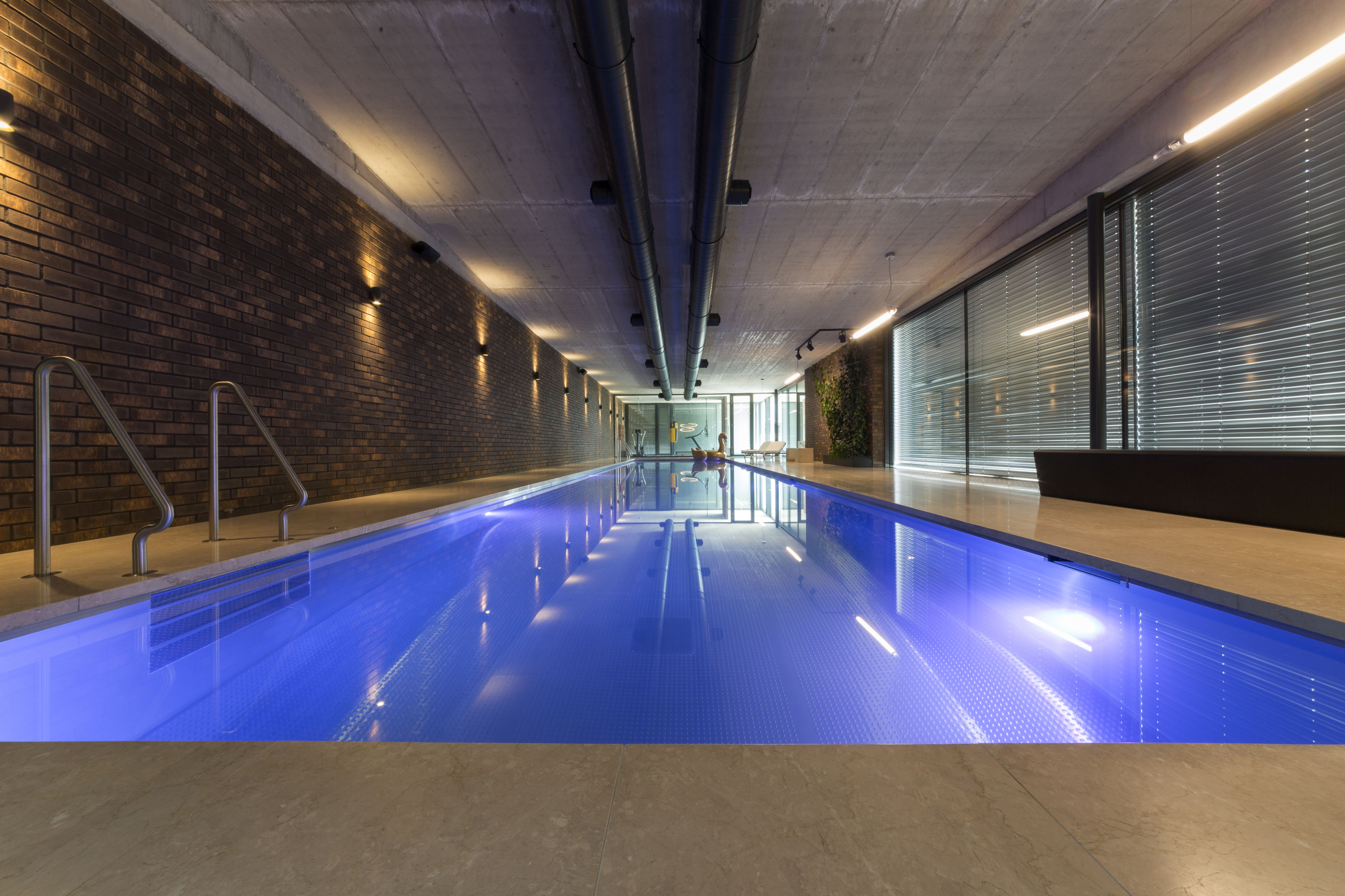 Modern indoor pool by IMAGINOX, 20 meters long