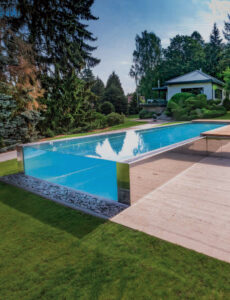 Infinity glass pool in czech garden
