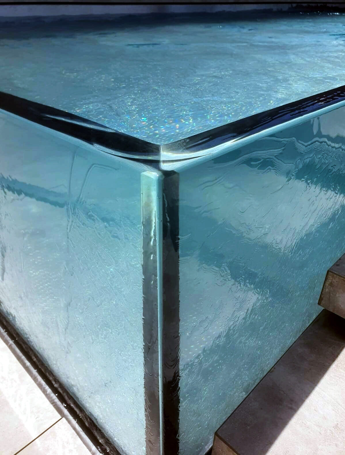 corner of a glass pool 